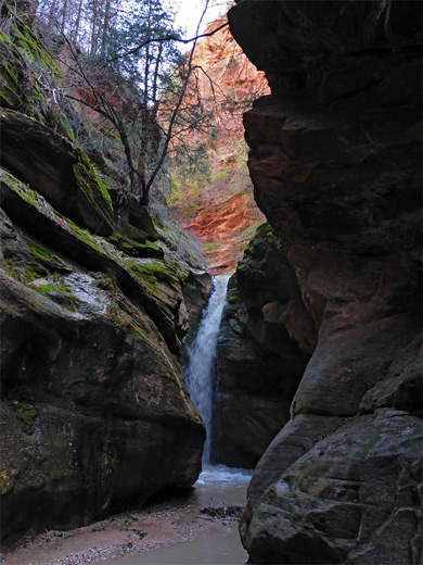 Dark cliffs around the stream