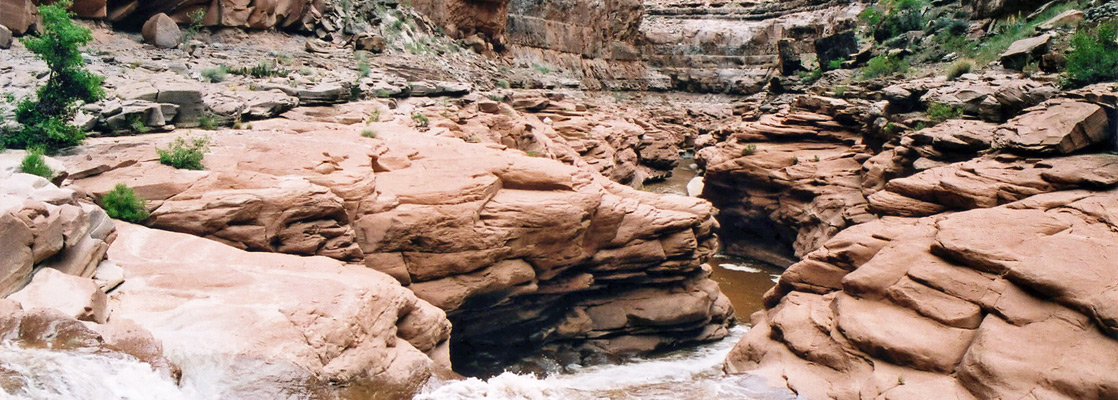 Cascade leading to a confined section of lower Dark Canyon
