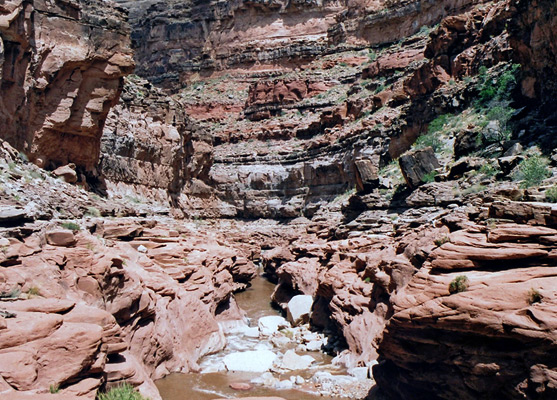 Passageway though layered, ledgy rocks