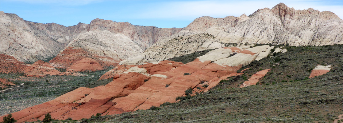 Red and white cliffs, and a lava cave