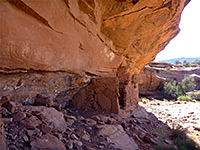 Ruin beneath overhanging cliffs