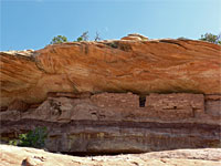 Ruin below overhanging cliff