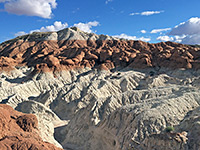 Red rocks above white