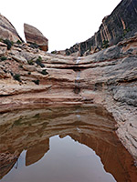 Boulder above a pool