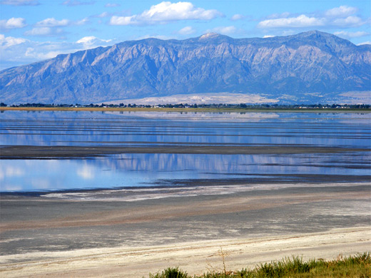 Shallow water alongside the causeway