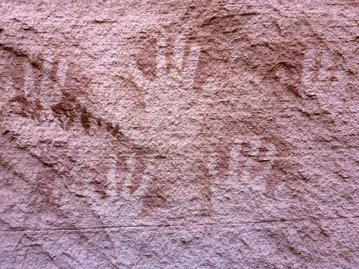 Five red handprint pictographs