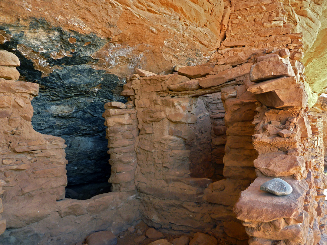 Ruins beside a blackened cliff