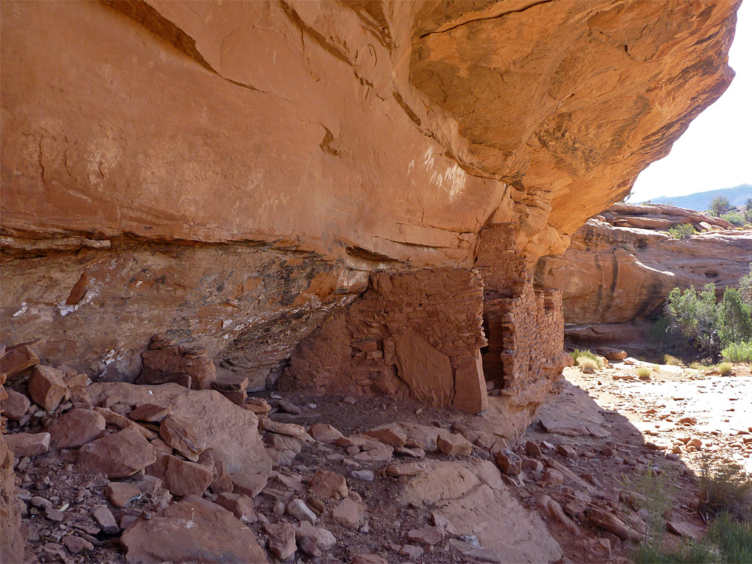 Ruin beneath overhanging cliffs