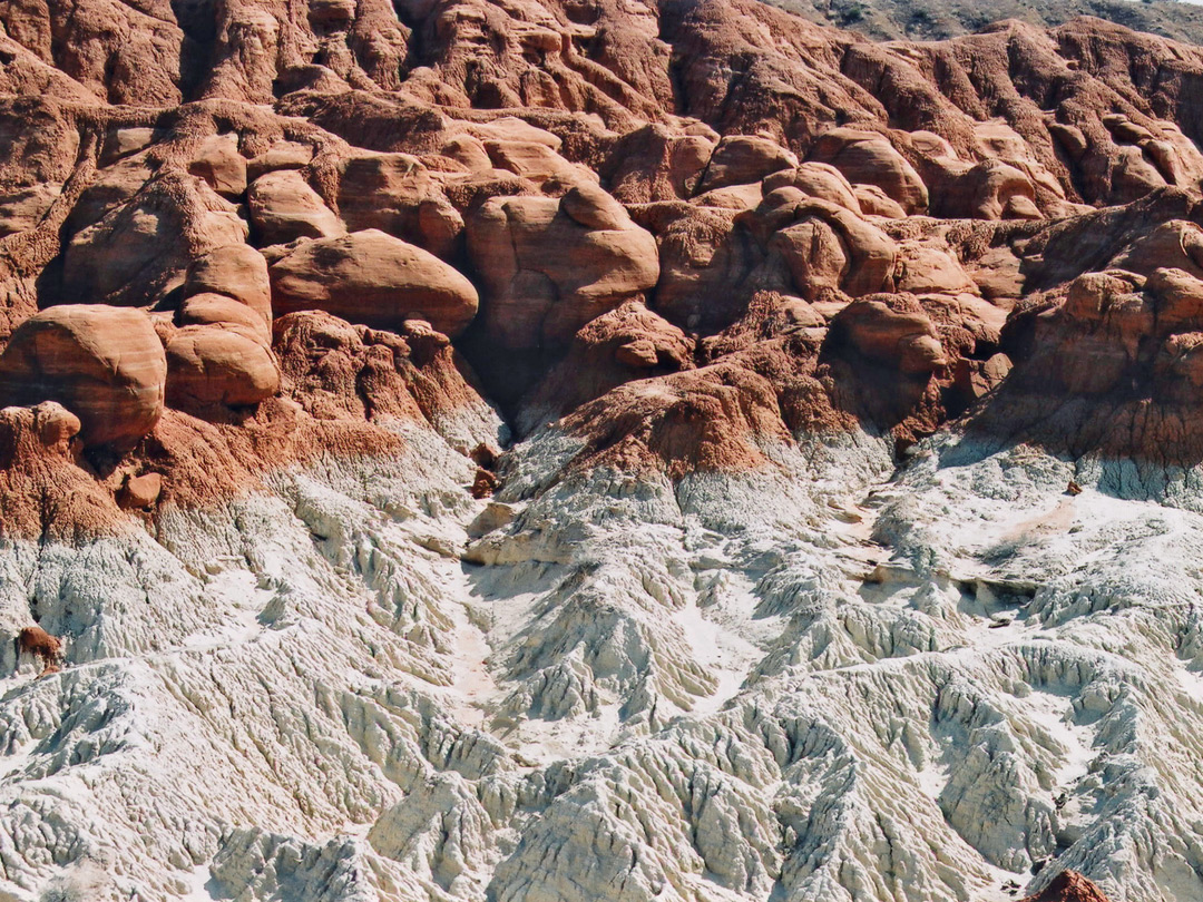 Red rocks above white