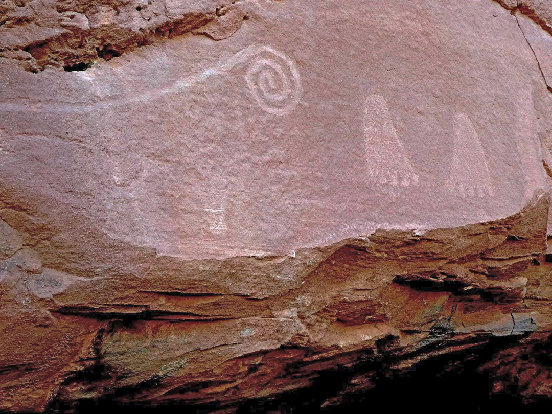 Feet and spiral petroglyphs