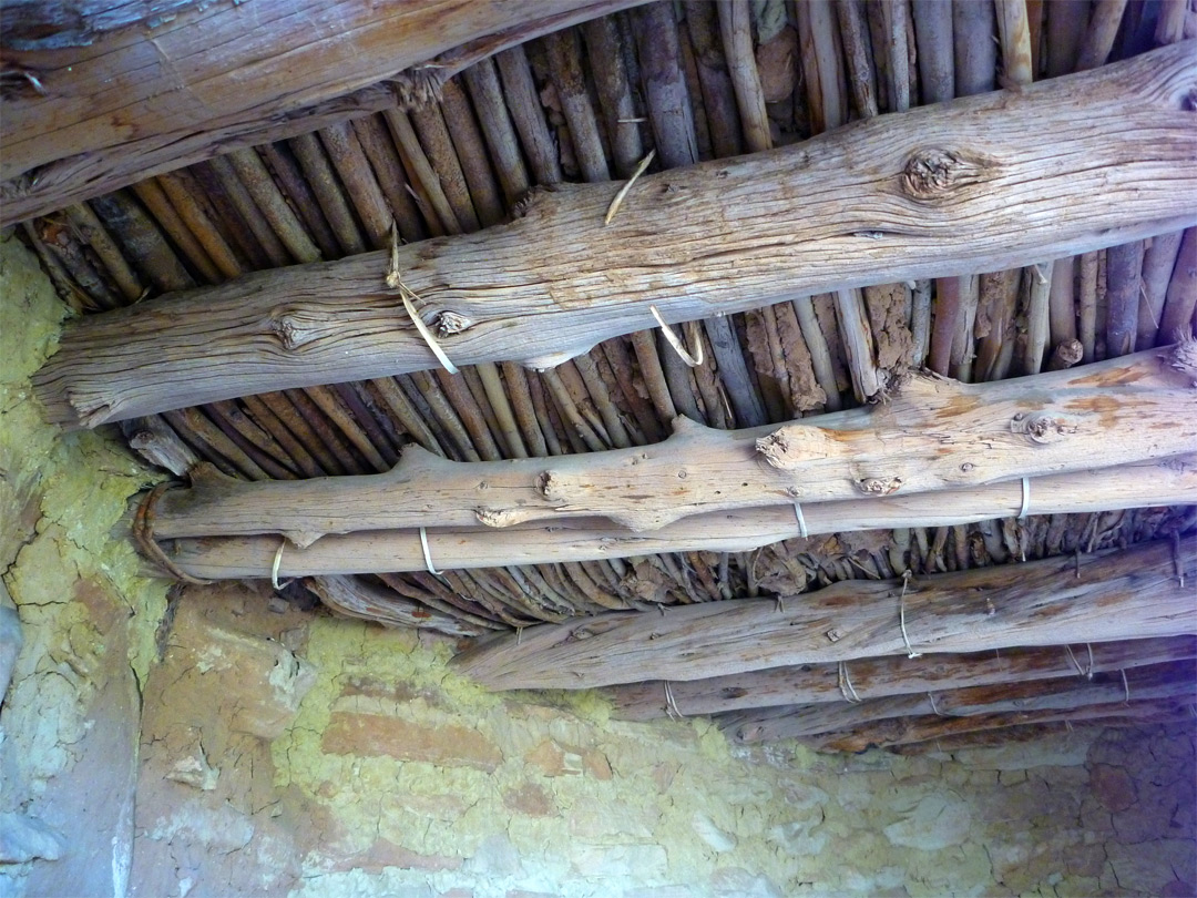Roof timbers and yellow adobe