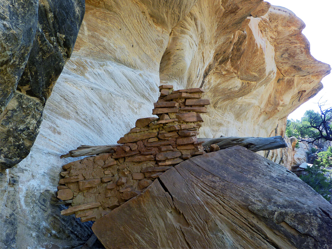 Broken wall and angular rocks